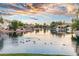 Waterfront homes surround a peaceful pond fostering a scenic and harmonious community environment at 435 E Coconino Pl, Chandler, AZ 85249