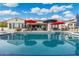 Inviting backyard pool with patio and outdoor lounge and dining areas and beautiful reflection of the sky at 435 E Coconino Pl, Chandler, AZ 85249