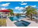 Beautiful pool and spa overlooking the lake and palm trees, perfect for outdoor relaxation and entertainment at 435 E Coconino Pl, Chandler, AZ 85249