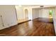 Spacious living room with wood flooring, featuring an open layout and bright, neutral tones throughout at 4547 W Villa Theresa Dr, Glendale, AZ 85308