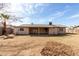 The back exterior offers a large yard, patio, and well maintained home at 4813 N 62Nd Ave, Phoenix, AZ 85033