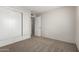 This bedroom has carpet, neutral walls and a closet with bi-fold doors at 4813 N 62Nd Ave, Phoenix, AZ 85033