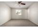 Bedroom featuring a ceiling fan, neutral carpet, and a window at 4813 N 62Nd Ave, Phoenix, AZ 85033