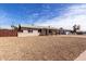 A lovely home with a spacious front yard, featuring a covered porch and easy-care desert landscaping at 4813 N 62Nd Ave, Phoenix, AZ 85033