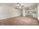 Bright living area with tile flooring, a ceiling fan, and an open layout connecting to the kitchen, great for entertaining at 4813 N 62Nd Ave, Phoenix, AZ 85033