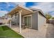 Charming backyard with covered patio, artificial turf, and brick pavers, great for outdoor living at 5030 S 23Rd Ave, Phoenix, AZ 85041