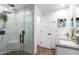 Modern bathroom with a glass-enclosed shower and dual-sink vanity with granite counters at 5030 S 23Rd Ave, Phoenix, AZ 85041