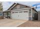 Single-Gathering home featuring a spacious two-car garage and desert landscaping in the front yard at 5030 S 23Rd Ave, Phoenix, AZ 85041