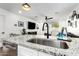 Modern kitchen featuring granite countertops and stainless steel appliances with hardwood floors at 5030 S 23Rd Ave, Phoenix, AZ 85041
