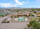 Well-manicured estate with a sparkling pool, mature palm trees, lush landscaping and scenic mountain views at 5203 N 179Th Dr, Litchfield Park, AZ 85340