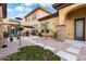 A backyard boasting gravel beds, stone walkways, manicured shrubbery, and ample seating area for relaxation at 5203 N 179Th Dr, Litchfield Park, AZ 85340