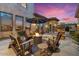 Stunning backyard featuring a cozy fire pit, outdoor seating, and picturesque desert landscaping at 5203 N 179Th Dr, Litchfield Park, AZ 85340