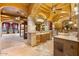 Luxurious bathroom with a soaking tub, decorative ceiling, and dual vanities at 5203 N 179Th Dr, Litchfield Park, AZ 85340