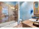 Bathroom showcasing a tiled shower, separate tub, toilet and sink with tiled countertop at 5203 N 179Th Dr, Litchfield Park, AZ 85340