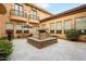 Picturesque courtyard with decorative fountain, comfortable seating, and lush greenery, perfect for relaxation at 5203 N 179Th Dr, Litchfield Park, AZ 85340