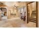 Welcoming foyer with stone accent wall, staircase, and views into the connecting rooms at 5203 N 179Th Dr, Litchfield Park, AZ 85340