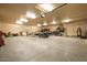 Spacious garage featuring high ceilings, ample storage, and a large open floor plan at 5203 N 179Th Dr, Litchfield Park, AZ 85340