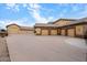 This home boasts an oversized six-car garage providing ample space for vehicles and storage at 5203 N 179Th Dr, Litchfield Park, AZ 85340