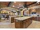 Gourmet kitchen with granite countertops, wooden cabinets, and breakfast bar at 5203 N 179Th Dr, Litchfield Park, AZ 85340
