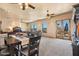 Expansive living room with multiple ceiling fans, views, and seamless indoor-outdoor living at 5203 N 179Th Dr, Litchfield Park, AZ 85340