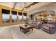 Spacious living room featuring stone archways, coffered ceilings and backyard views at 5203 N 179Th Dr, Litchfield Park, AZ 85340
