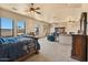 Main bedroom features large windows and a ceiling fan at 5203 N 179Th Dr, Litchfield Park, AZ 85340