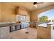 Covered outdoor kitchen complete with stainless steel grill, prep areas, and sink at 5203 N 179Th Dr, Litchfield Park, AZ 85340