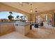 Covered outdoor living space featuring a bar, seating and views of the pool at 5203 N 179Th Dr, Litchfield Park, AZ 85340