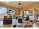 Spacious covered patio with comfortable seating, perfect for outdoor entertaining at 5203 N 179Th Dr, Litchfield Park, AZ 85340