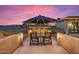 Relaxing patio featuring an umbrella, mountain views, and comfortable seating at 5203 N 179Th Dr, Litchfield Park, AZ 85340