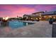 Resort-style pool with beautiful fire features, relaxing lounge area, and lush desert landscaping at 5203 N 179Th Dr, Litchfield Park, AZ 85340