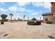 A tranquil pool area with palm trees offers a desert oasis for relaxation and outdoor enjoyment at 5203 N 179Th Dr, Litchfield Park, AZ 85340