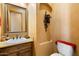 Powder room showcasing a sink with vanity, a decorative light fixture, and a toilet at 5203 N 179Th Dr, Litchfield Park, AZ 85340