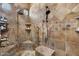 Custom tile shower with multiple shower heads and bench seating at 5203 N 179Th Dr, Litchfield Park, AZ 85340