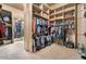 Spacious walk-in closet features custom shelving and ample storage space for clothes and accessories at 5203 N 179Th Dr, Litchfield Park, AZ 85340