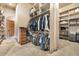 Large walk-in closet with custom shelving, providing generous storage space for clothes and personal items at 5203 N 179Th Dr, Litchfield Park, AZ 85340