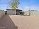 Spacious backyard with desert landscaping and a covered patio area perfect for relaxing at 533 N Sirrine --, Mesa, AZ 85201