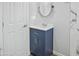Modern bathroom with a vanity and stylish mirror, next to a freshly painted door at 533 N Sirrine --, Mesa, AZ 85201