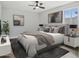 Comfortable main bedroom with natural light, ceiling fan, and soothing wall art at 533 N Sirrine --, Mesa, AZ 85201