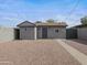 Charming single-story home with stucco exterior and low-maintenance desert landscaping at 533 N Sirrine --, Mesa, AZ 85201