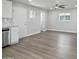 Bright living room with wood-look floors and neutral paint, ideal for entertaining and relaxing at 533 N Sirrine --, Mesa, AZ 85201