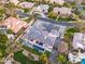 Aerial view of a beautiful home with pool, lush greenery, and well-maintained landscaping at 7120 E Paradise Ranch Rd, Paradise Valley, AZ 85253