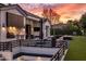 Outdoor kitchen and sunken patio offer a relaxing spot to take in the colorful sunset at 7120 E Paradise Ranch Rd, Paradise Valley, AZ 85253