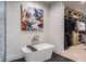 Freestanding soaking tub in the primary bathroom near the open closet at 7120 E Paradise Ranch Rd, Paradise Valley, AZ 85253