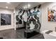 A modern bathroom featuring unique wall art, a freestanding tub, and a glass enclosed shower at 7120 E Paradise Ranch Rd, Paradise Valley, AZ 85253