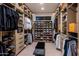 Spacious walk-in closet with custom shelving and shoe racks for ample storage at 7120 E Paradise Ranch Rd, Paradise Valley, AZ 85253