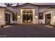 Beautiful front exterior with a paved driveway and a landscaped yard at 7120 E Paradise Ranch Rd, Paradise Valley, AZ 85253