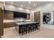 Contemporary kitchen showcasing sleek cabinets, a marble backsplash, and an eat-in island at 7120 E Paradise Ranch Rd, Paradise Valley, AZ 85253