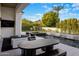 Modern outdoor patio boasts a sleek pool, spa, and elegant lounge furniture at 7120 E Paradise Ranch Rd, Paradise Valley, AZ 85253