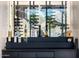 Elegant glass wine display with artistic backdrop, showcasing bottles and spirits at 7120 E Paradise Ranch Rd, Paradise Valley, AZ 85253